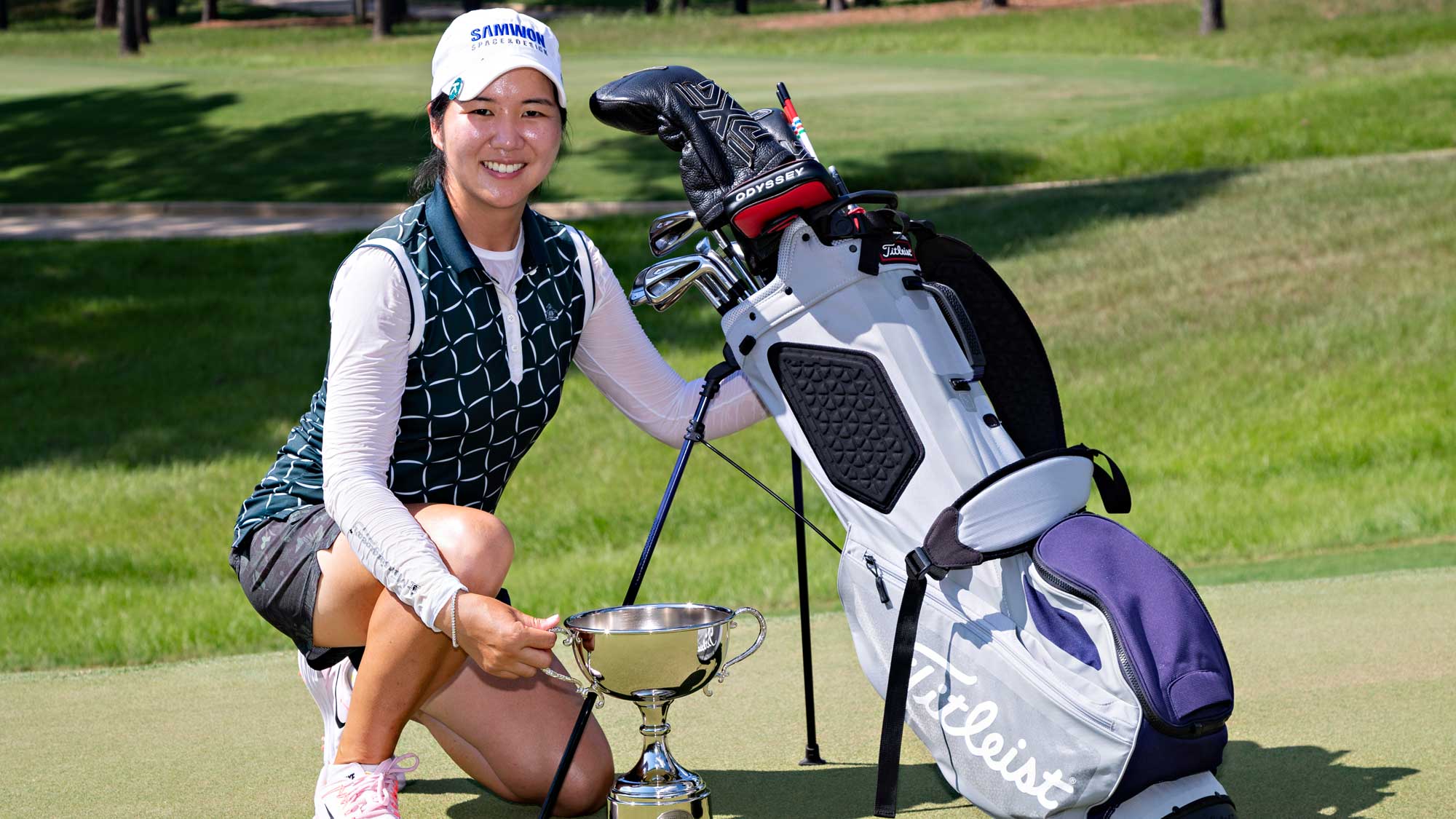 Hyemin Kim poses with the trophy after winning the 2018 Murphy USA El Dorado Shootout