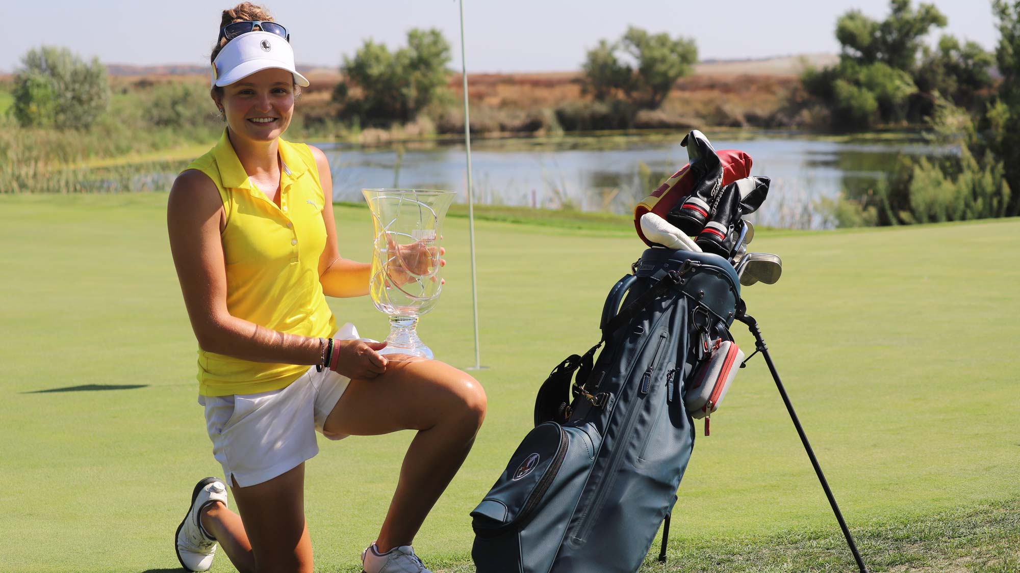 Fatima Fernandez Cano with IOA Champ trophy and bag