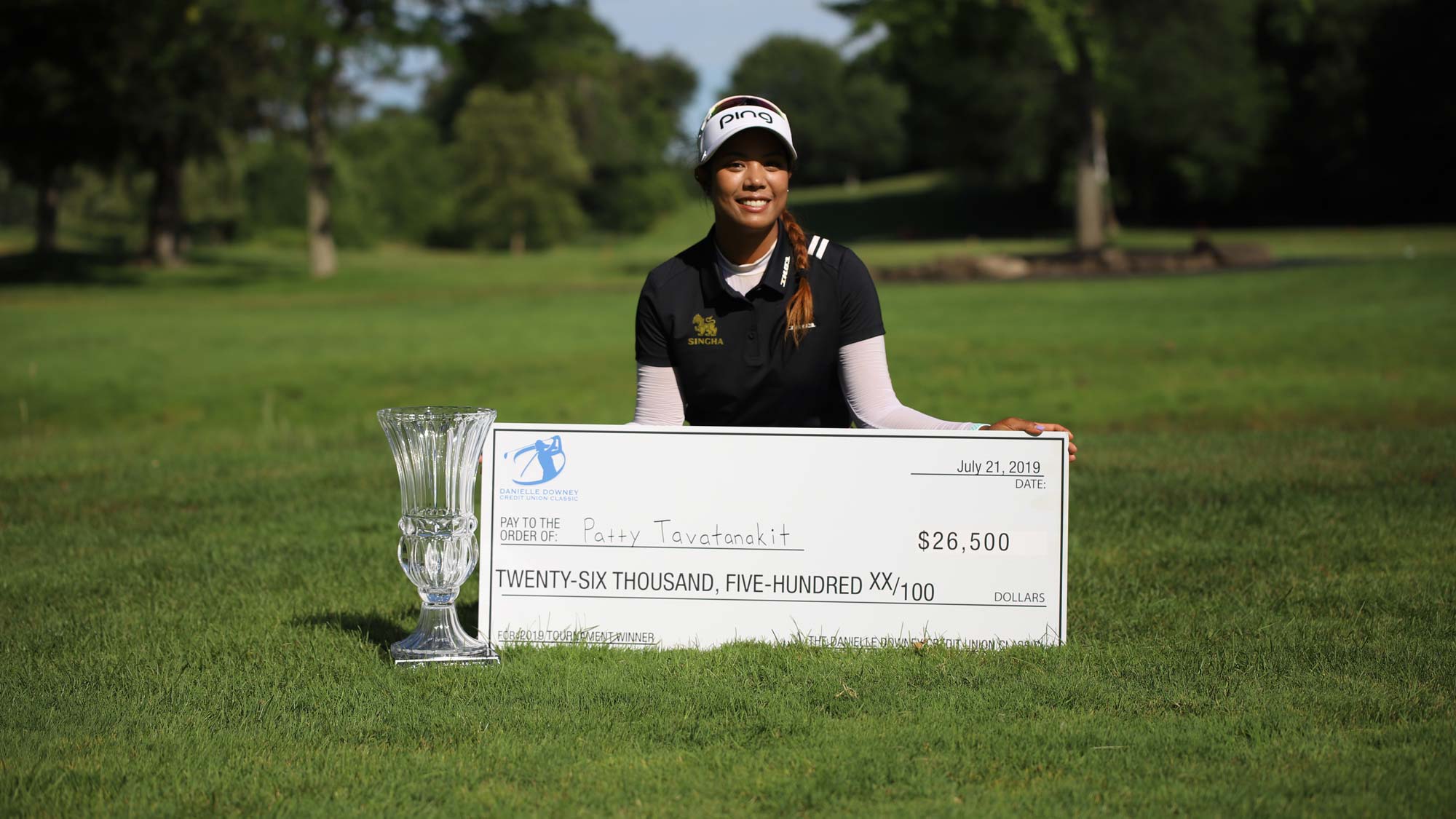 Patty Tavatanakit with check and trophy