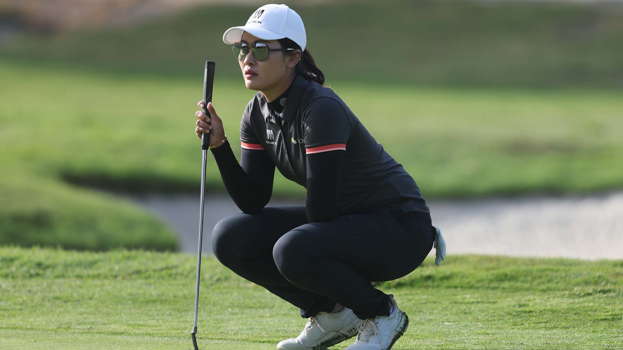 Xiyu Lin of China lines up a putt on the first green during the first round of the JM Eagle LA Championship presented by Plastpro